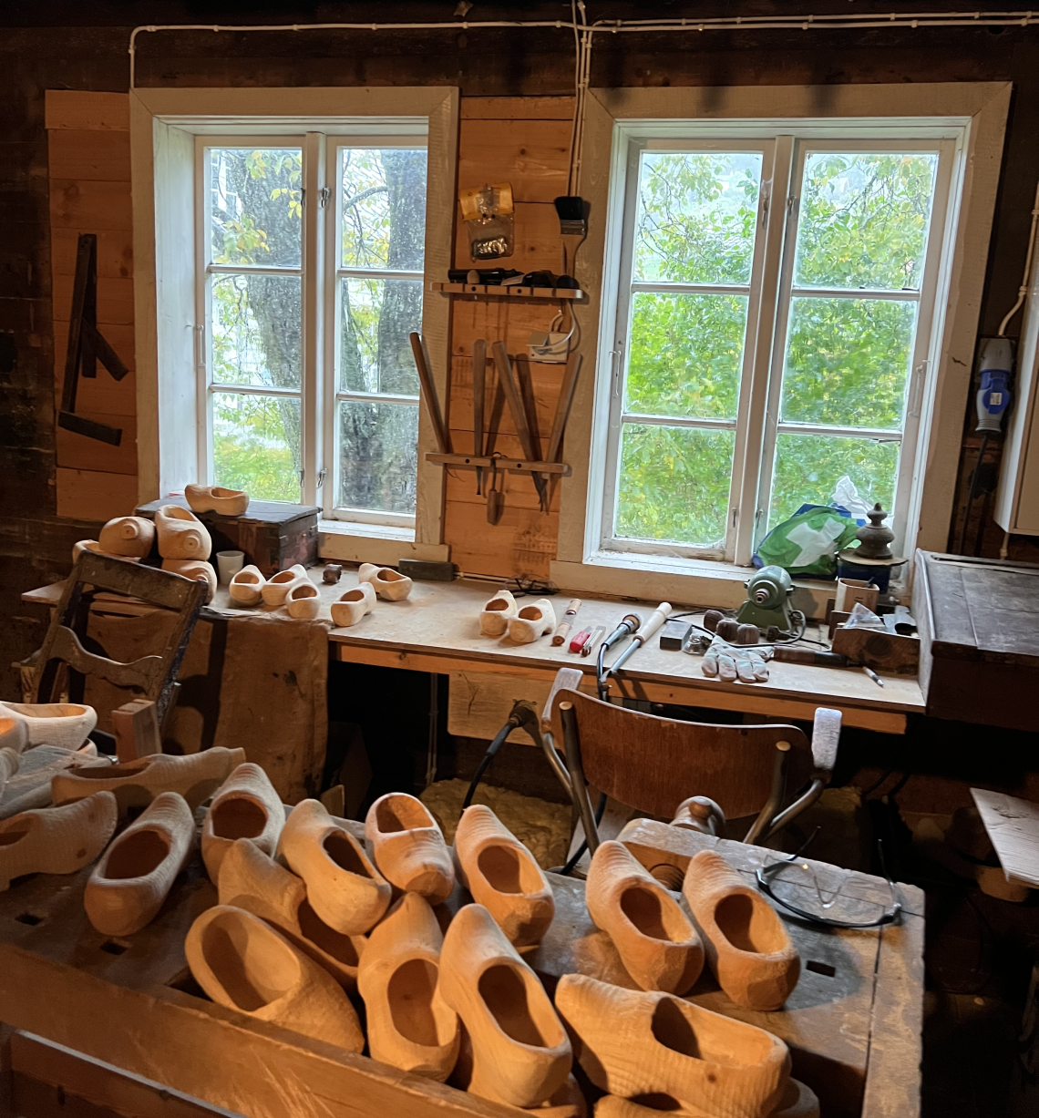 Inside a Norwegian wooden shoe workshop with clogs and tools  