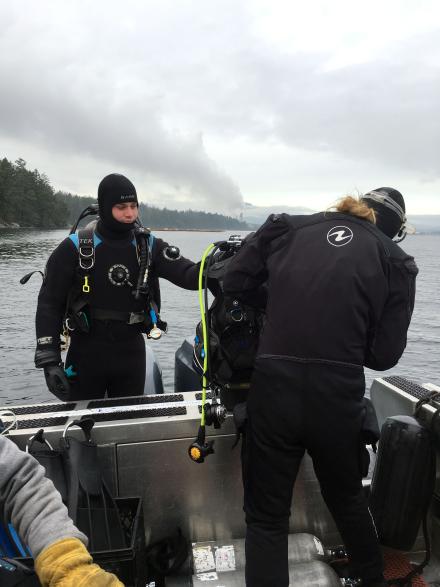 Divers, Mark Bright and Chrissy Schellenberg, prepping for their dive at the Dodd Narrows site.