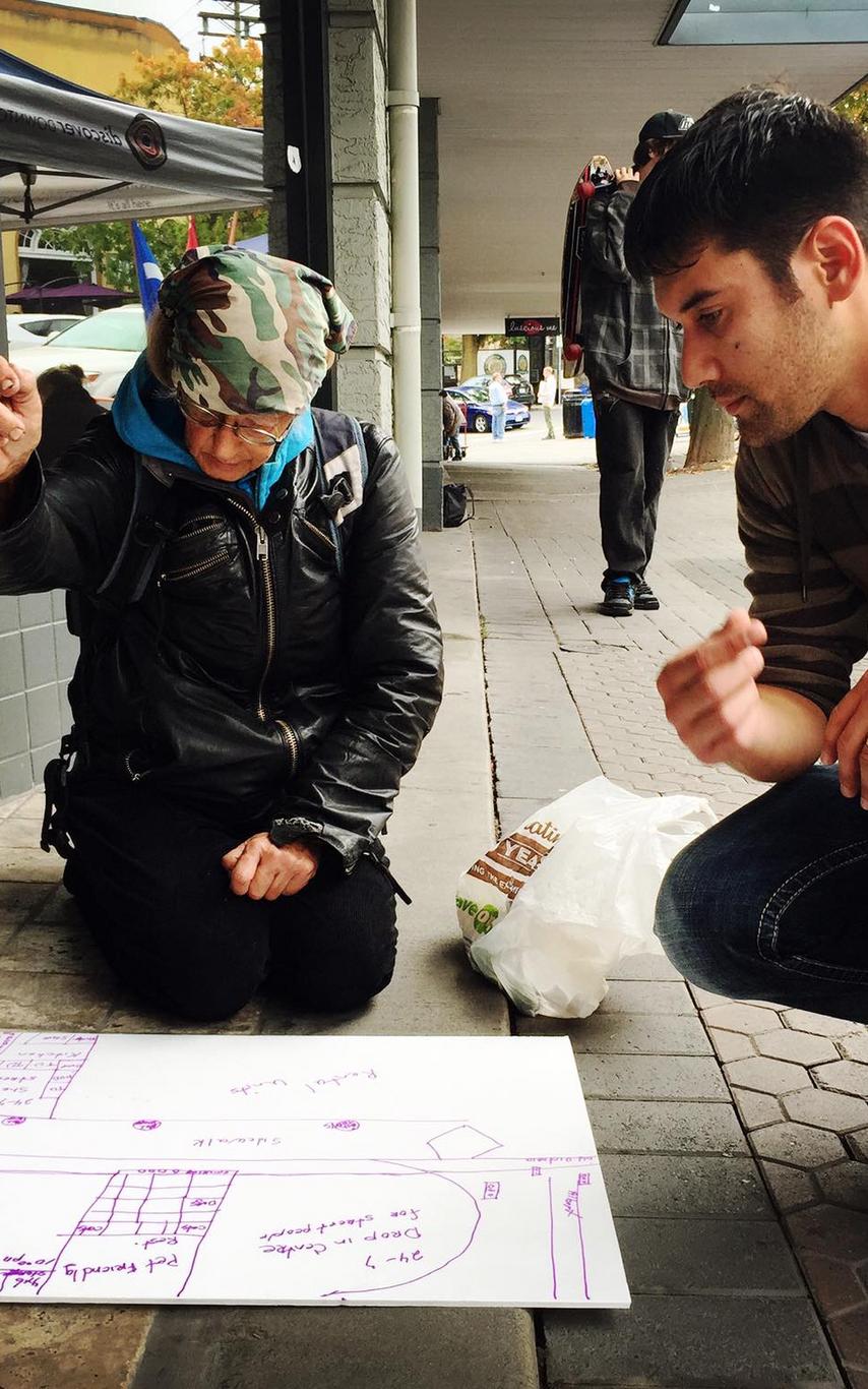 Students revisioning at parking day event